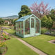 Lichfield 6x6 Wooden Greenhouse in wider garden landscape
