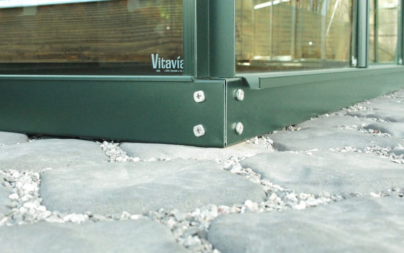Vitavia greenhouse base fitted on a paving slab foundation