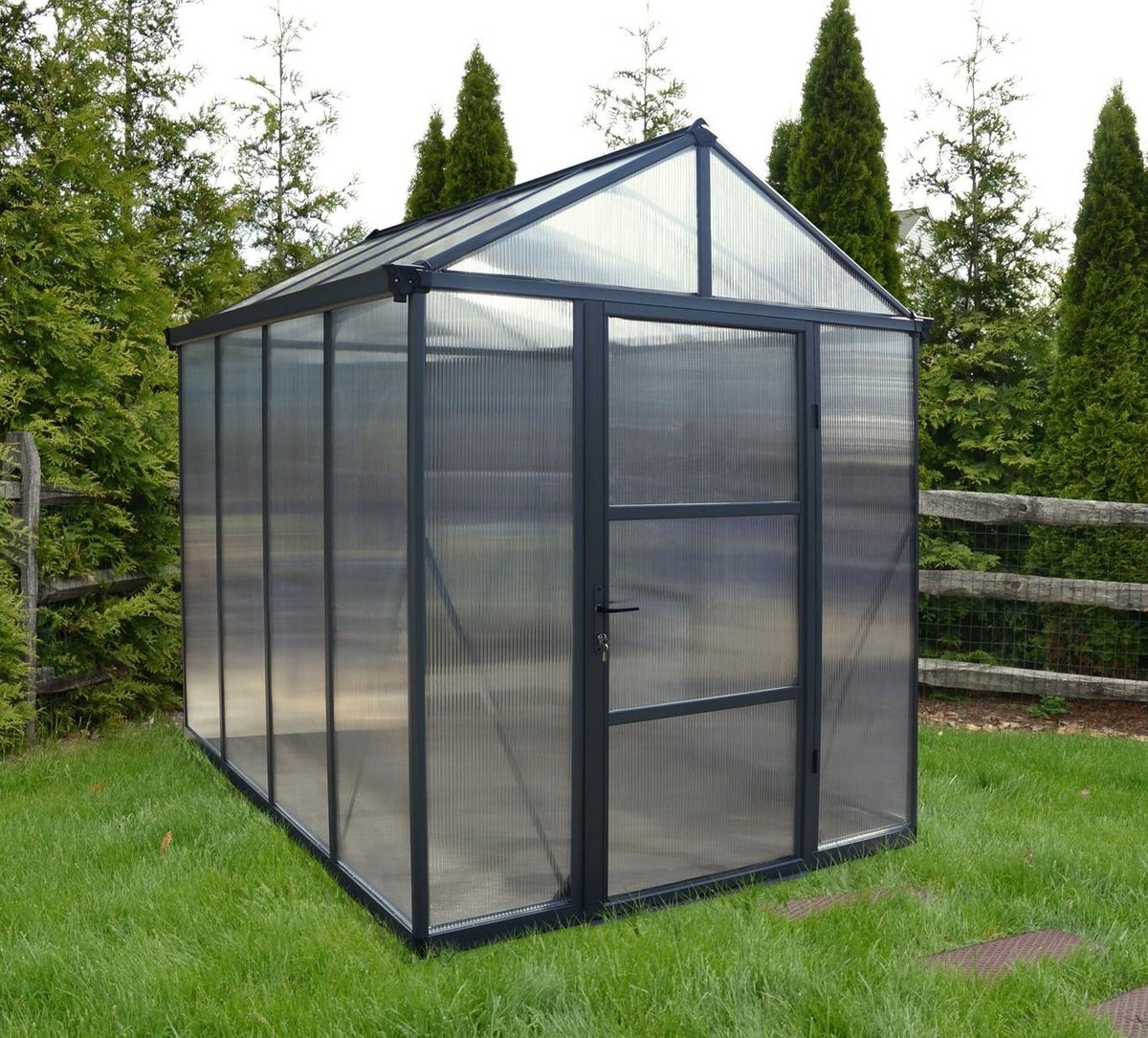 Palram Canopia Glory 6x8 grey polycarbonate greenhouse in a UK garden used for pest-managed greenhouse growing